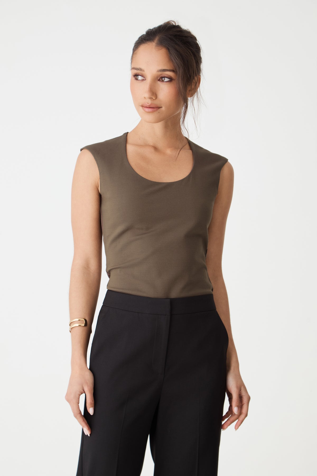 Close-up front view of the mocha brown top showing rounded square neckline and cap sleeves