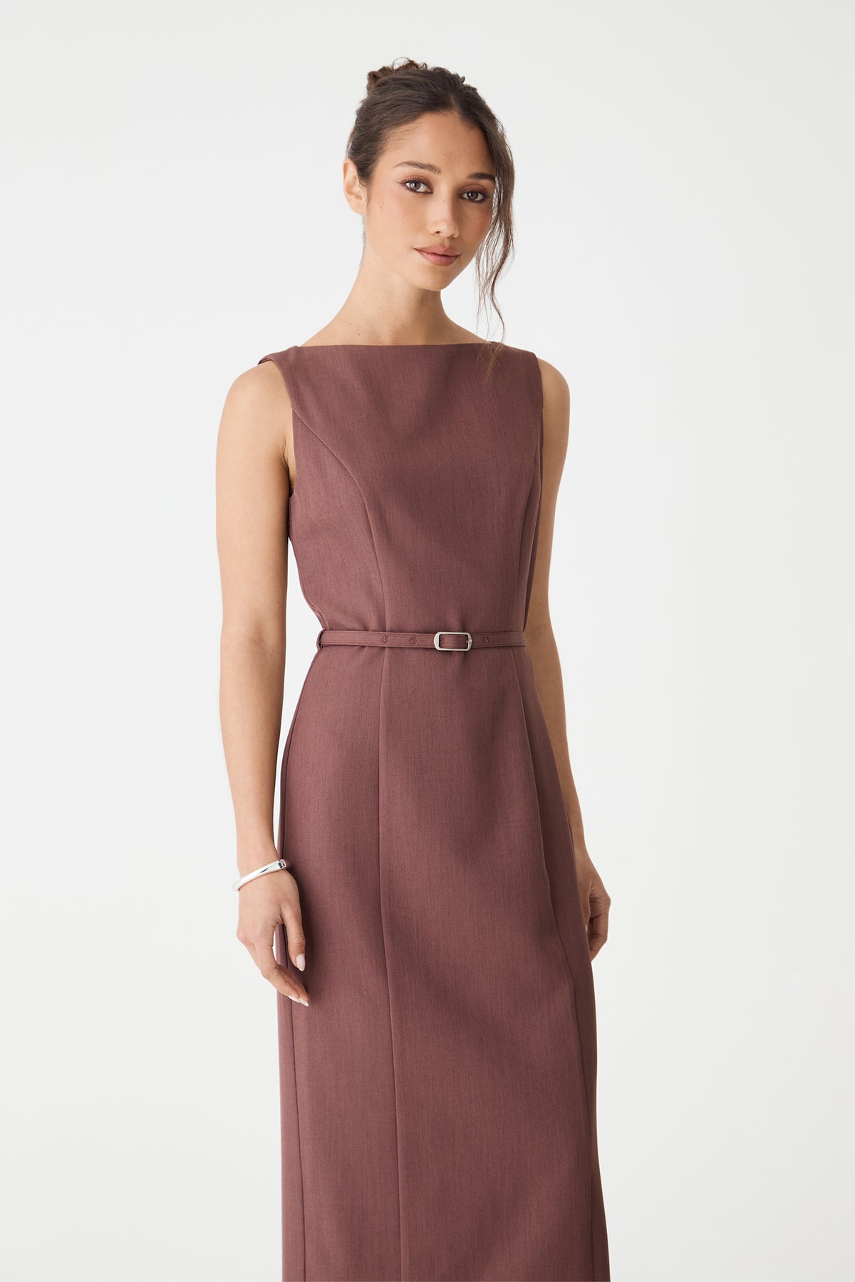 Close-up of the boat neckline and belt buckle on the cinnamon pencil midi dress