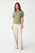 Jemma Relaxed Knit Top in soft khaki, front view worn with cream wide-leg trousers