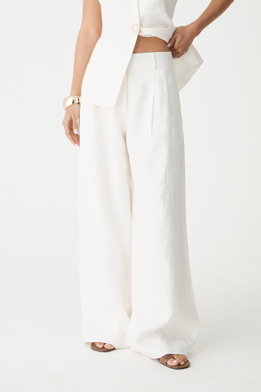 Ami Wide Leg Linen Pants in White, side view close-up showing pleated front and side pocket