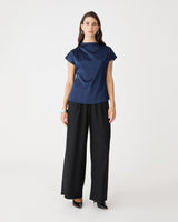 Zafina Pleated Draped Top in navy, front view worn with black wide-leg trousers