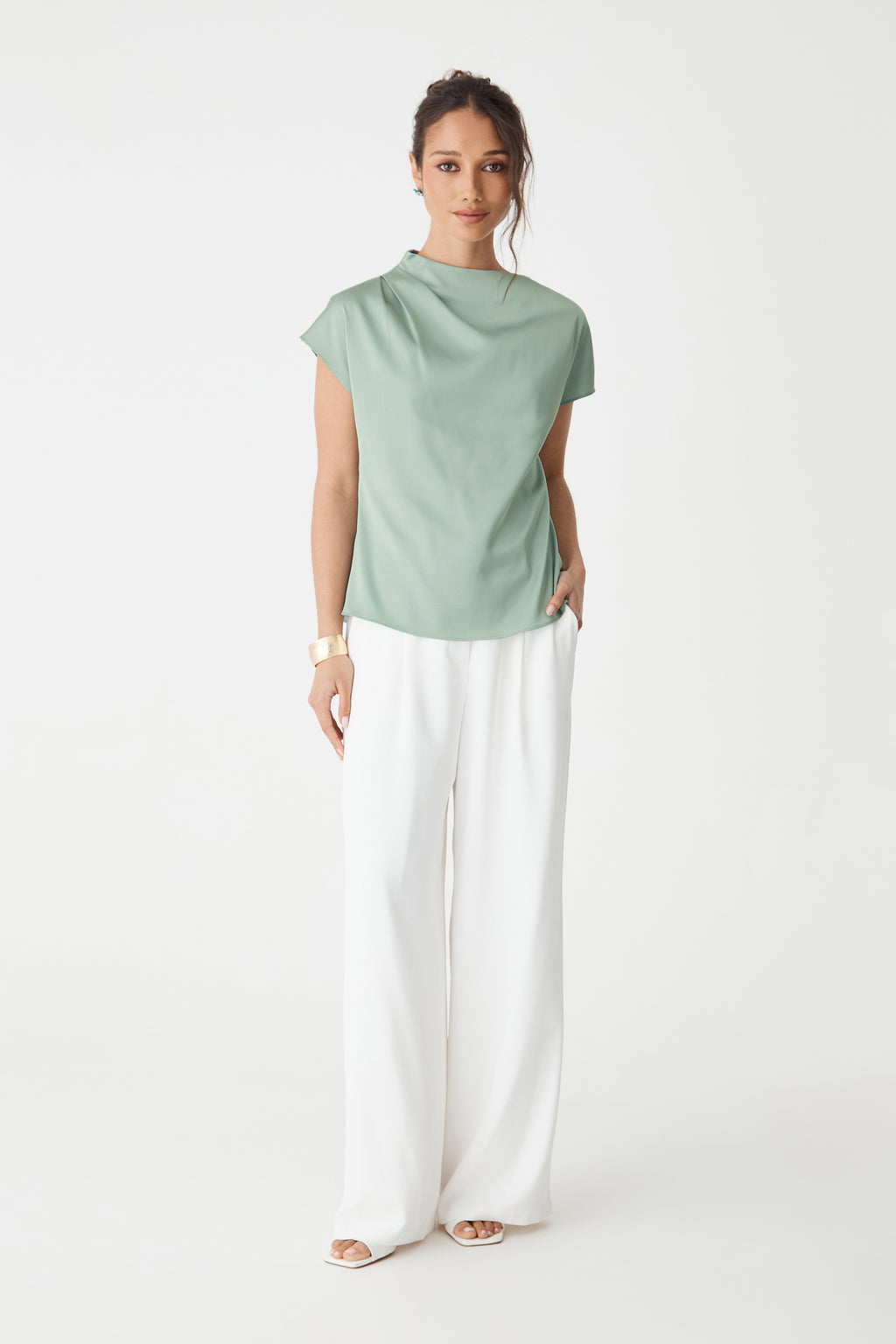 Zafina Pleated Draped Top in spearmint, front view worn with white wide-leg trousers