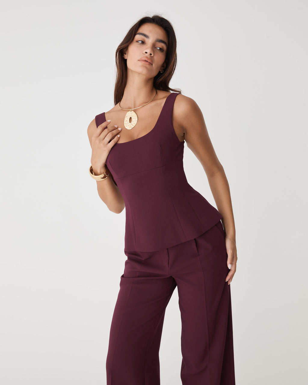 Nikki Peplum Top in bordeaux — close-up view
