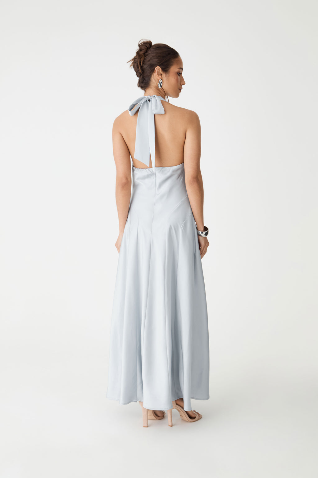 Back view showing open cutaway back and long tie bow fastening