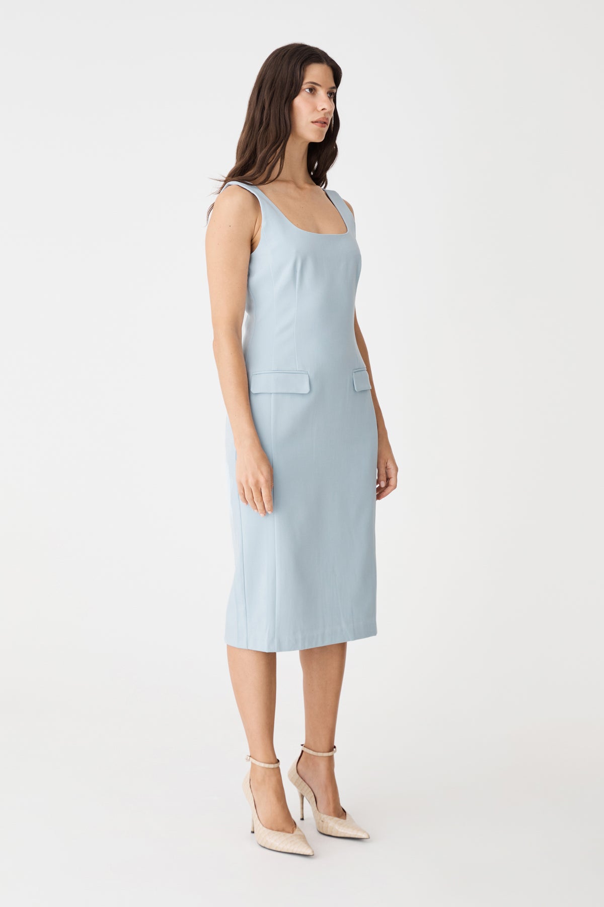 Side view of the sky blue pencil dress showing fitted midi silhouette