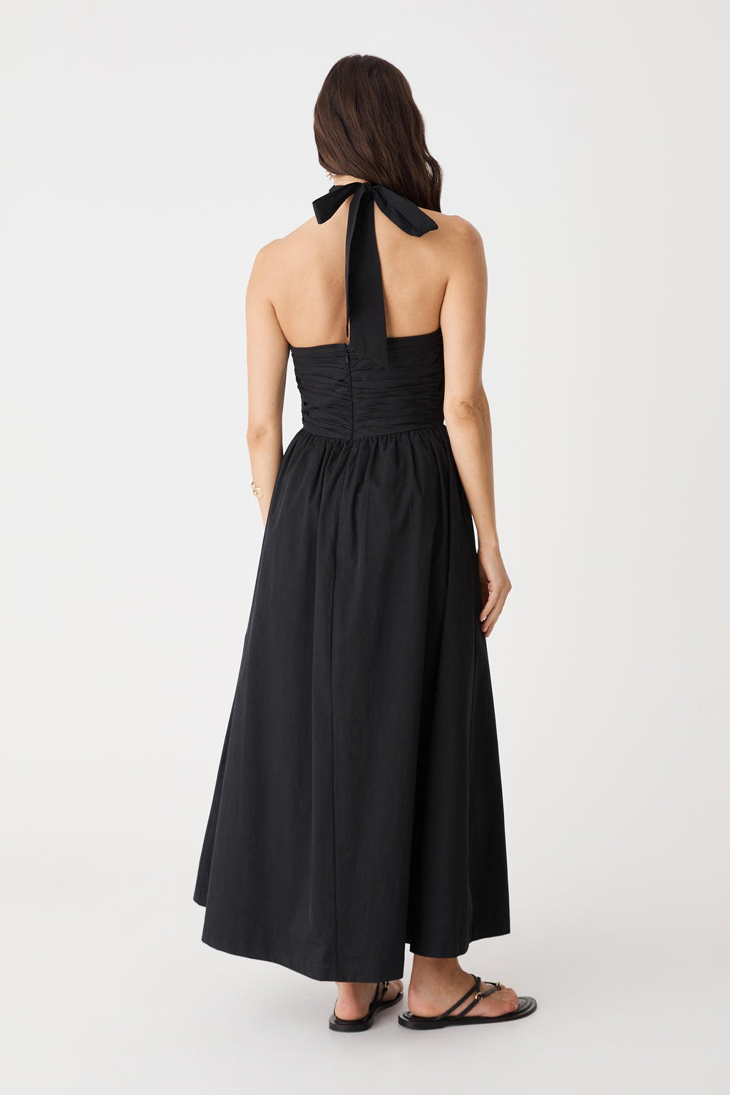Back view showing the open back and neck tie of the black Kayleigh Cotton Halter Dress