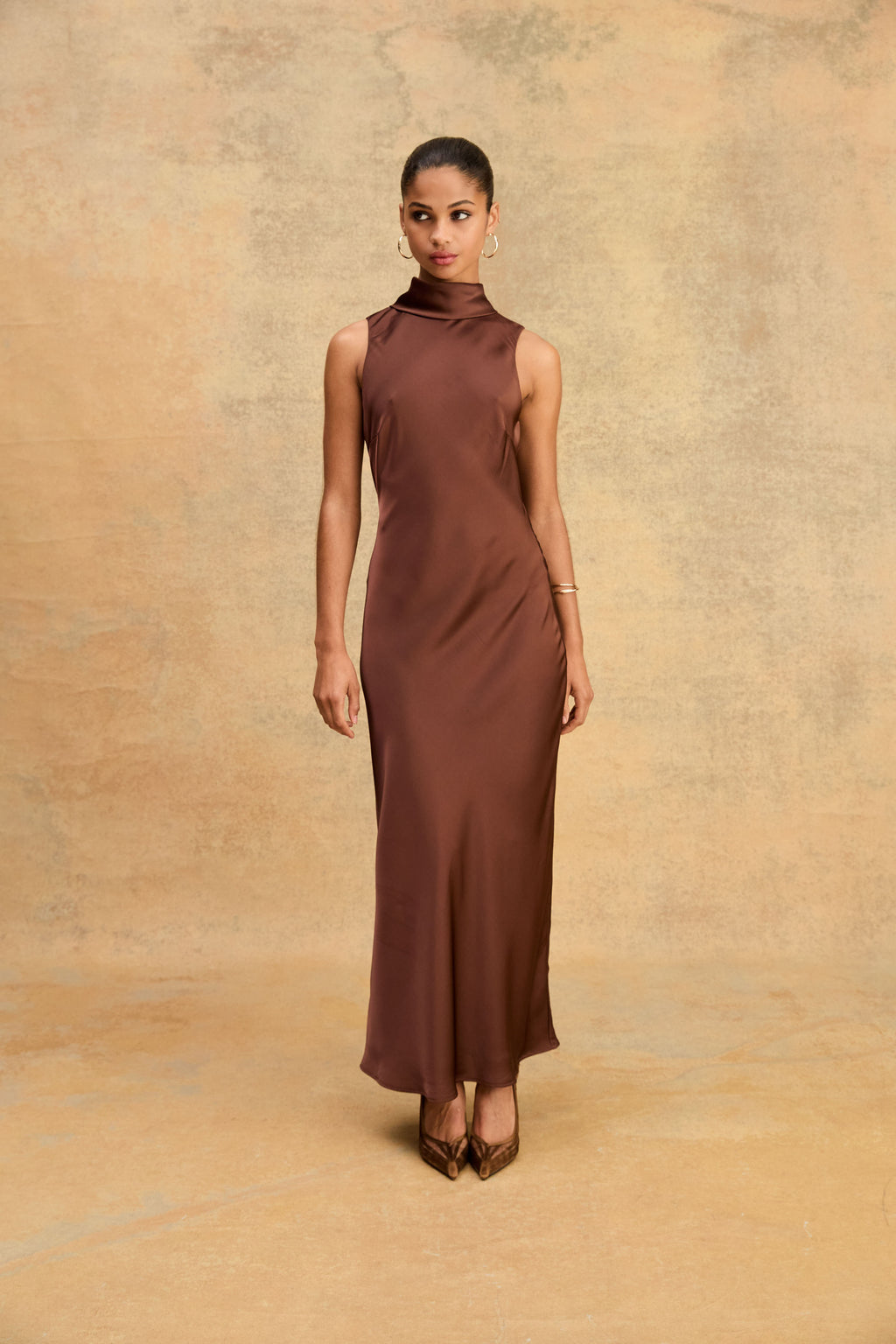 Front view of the Fudge satin maxi dress worn with heels