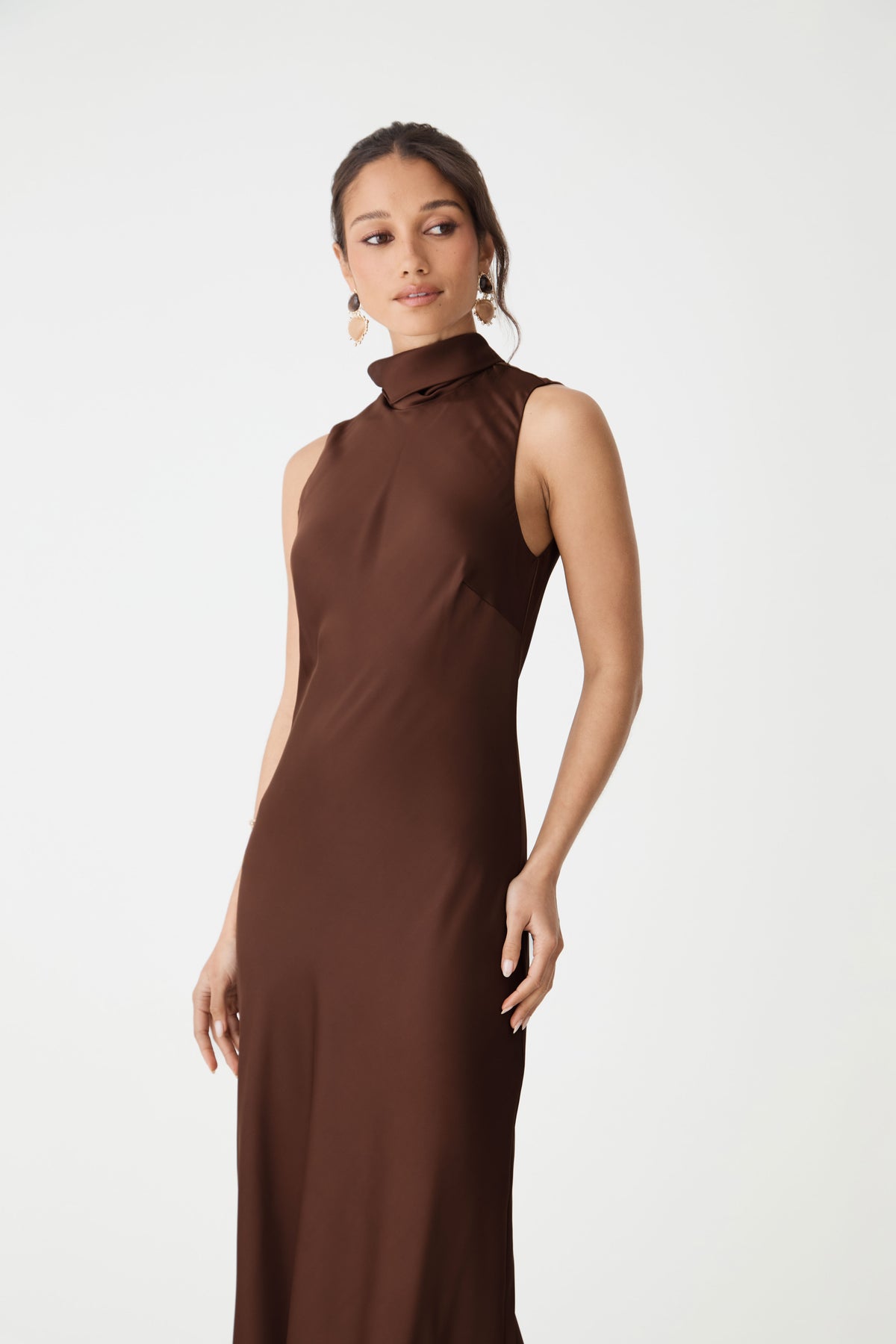 Close-up of the high mock neckline and cutaway shoulder in fudge satin