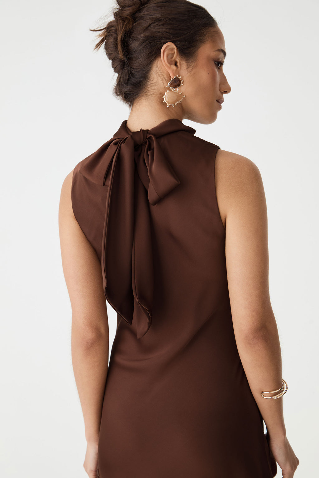 Back close-up of the self-tie neck sash forming a bow