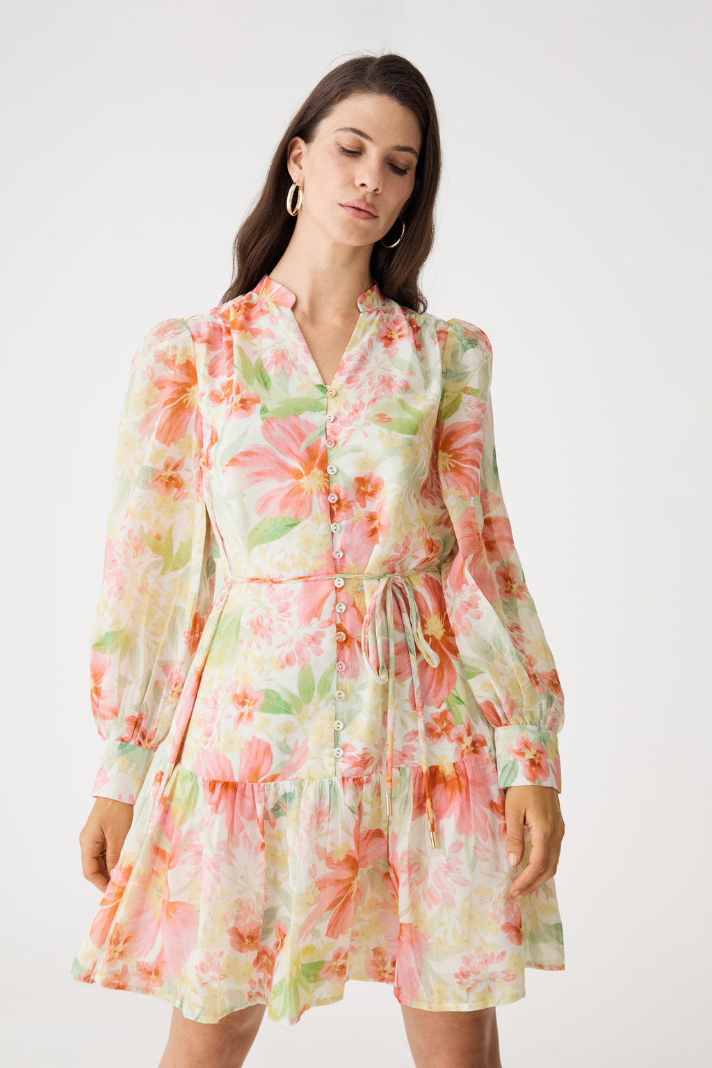 Close front view of the mandarin collar V-neckline and watercolour floral print