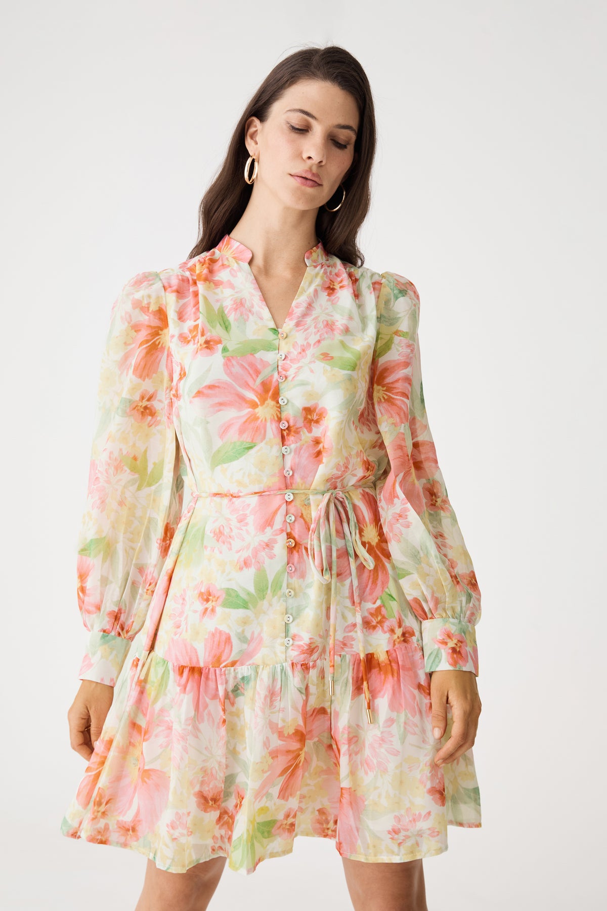 Close front view of the mandarin collar V-neckline and watercolour floral print