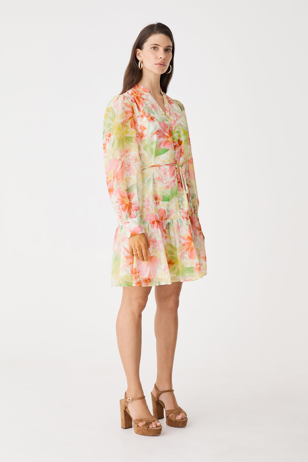 Side view showing blouson sleeves and tiered hem of the pink floral dress