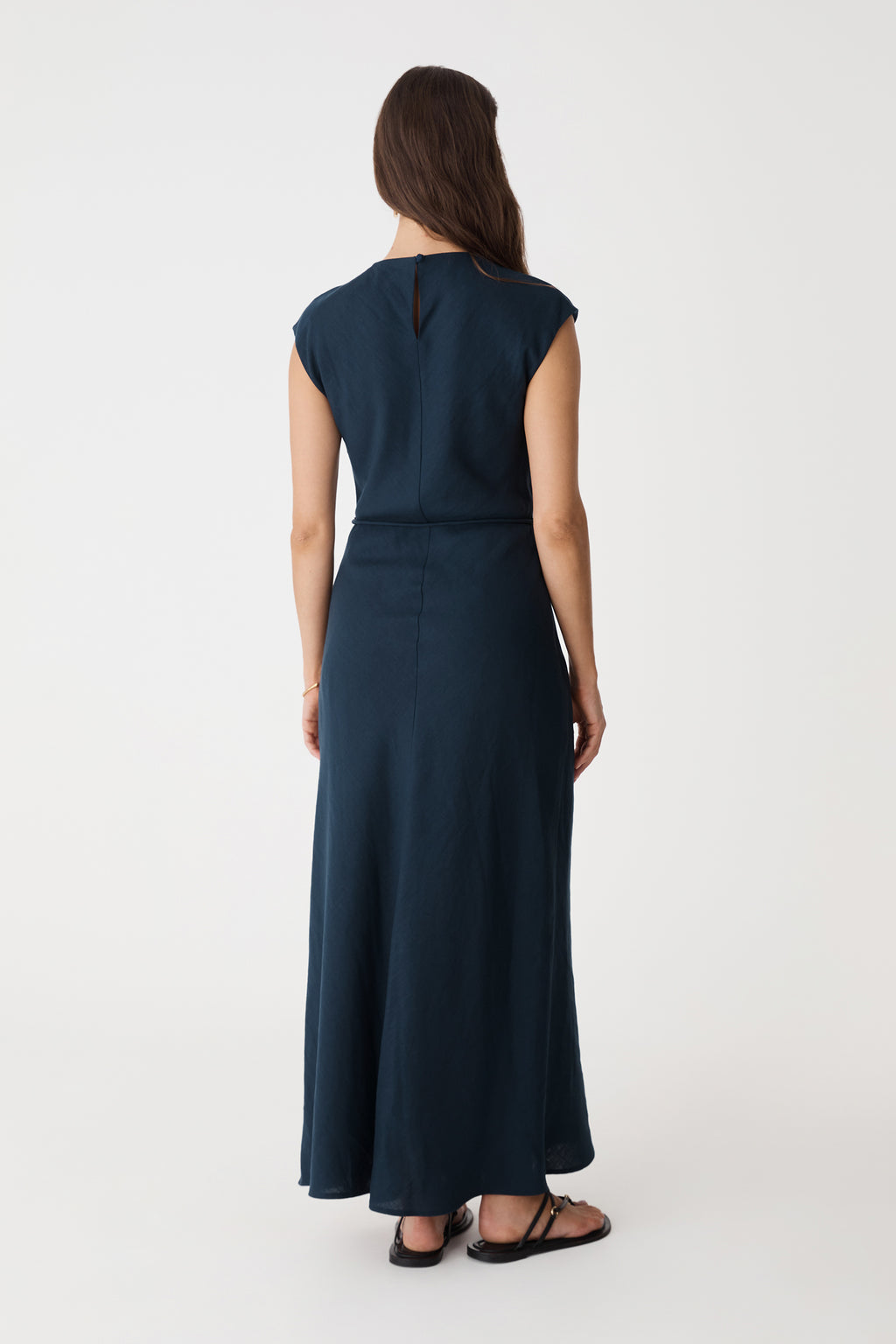 Back view of the navy maxi dress showing the back keyhole opening