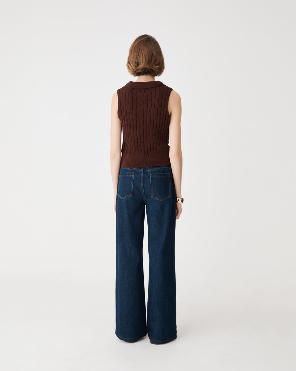 Back view showing patch pockets and wide leg line of the dark denim jeans