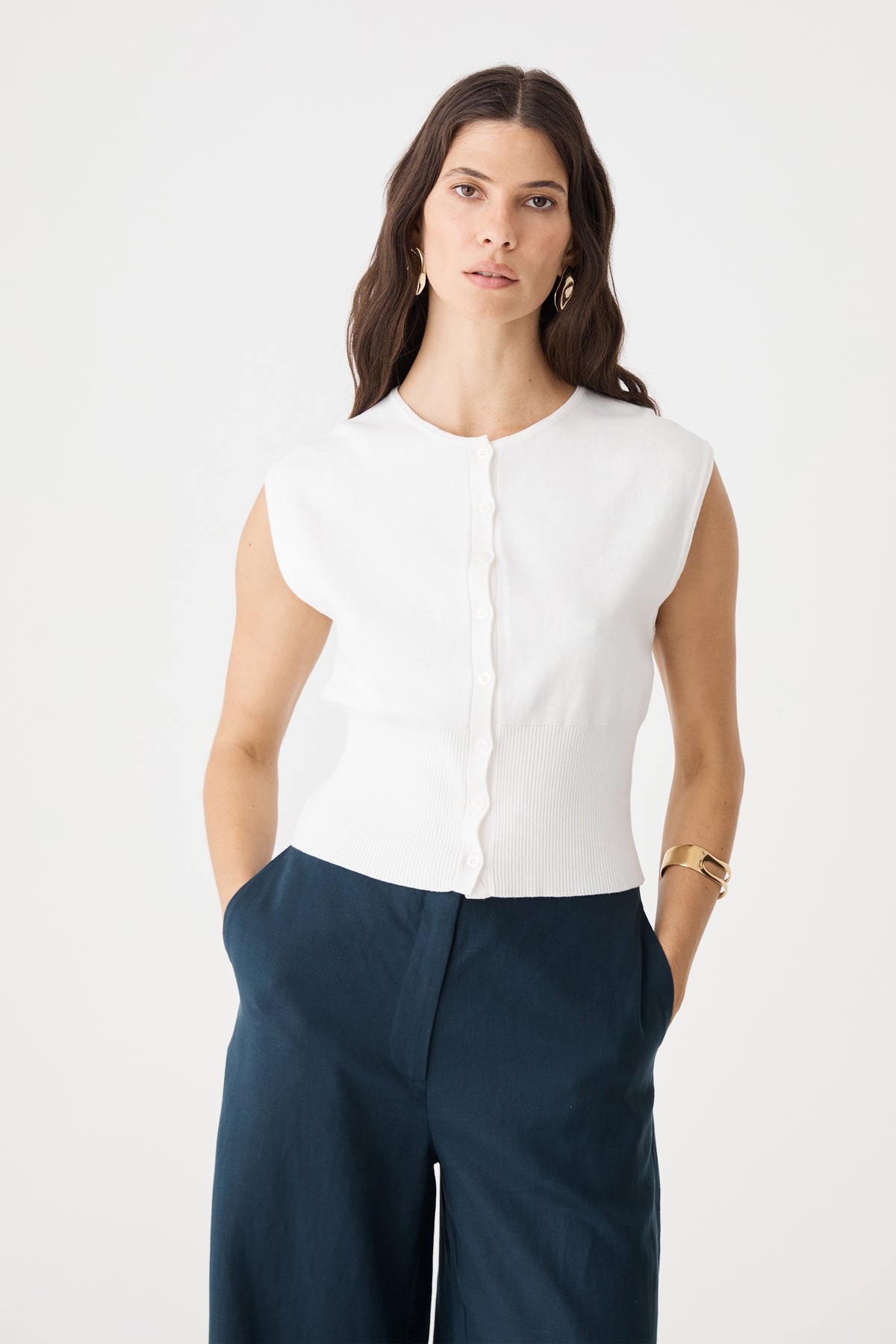 Front close-up of the ivory Faye Sleeveless Button Up Knit showing tonal button placket and round neckline