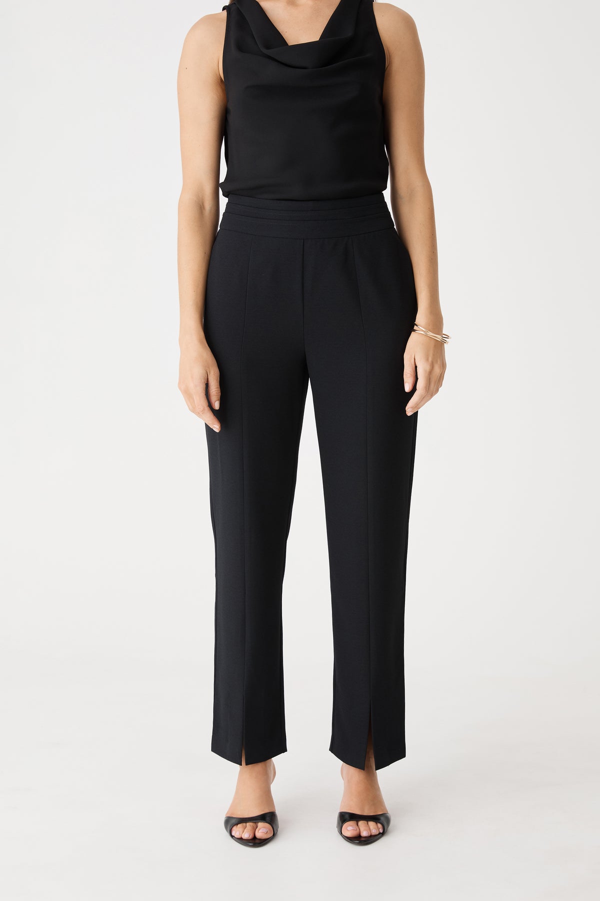 Front view of the black Tilda Split Hem Pants showing front seam detailing and split hems