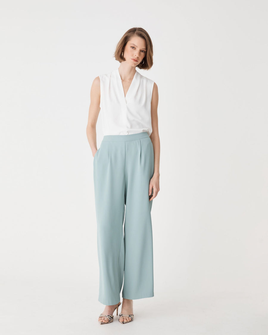 Maggie Elastic Waist Pants in Eucalyptus, front view worn with a white sleeveless top