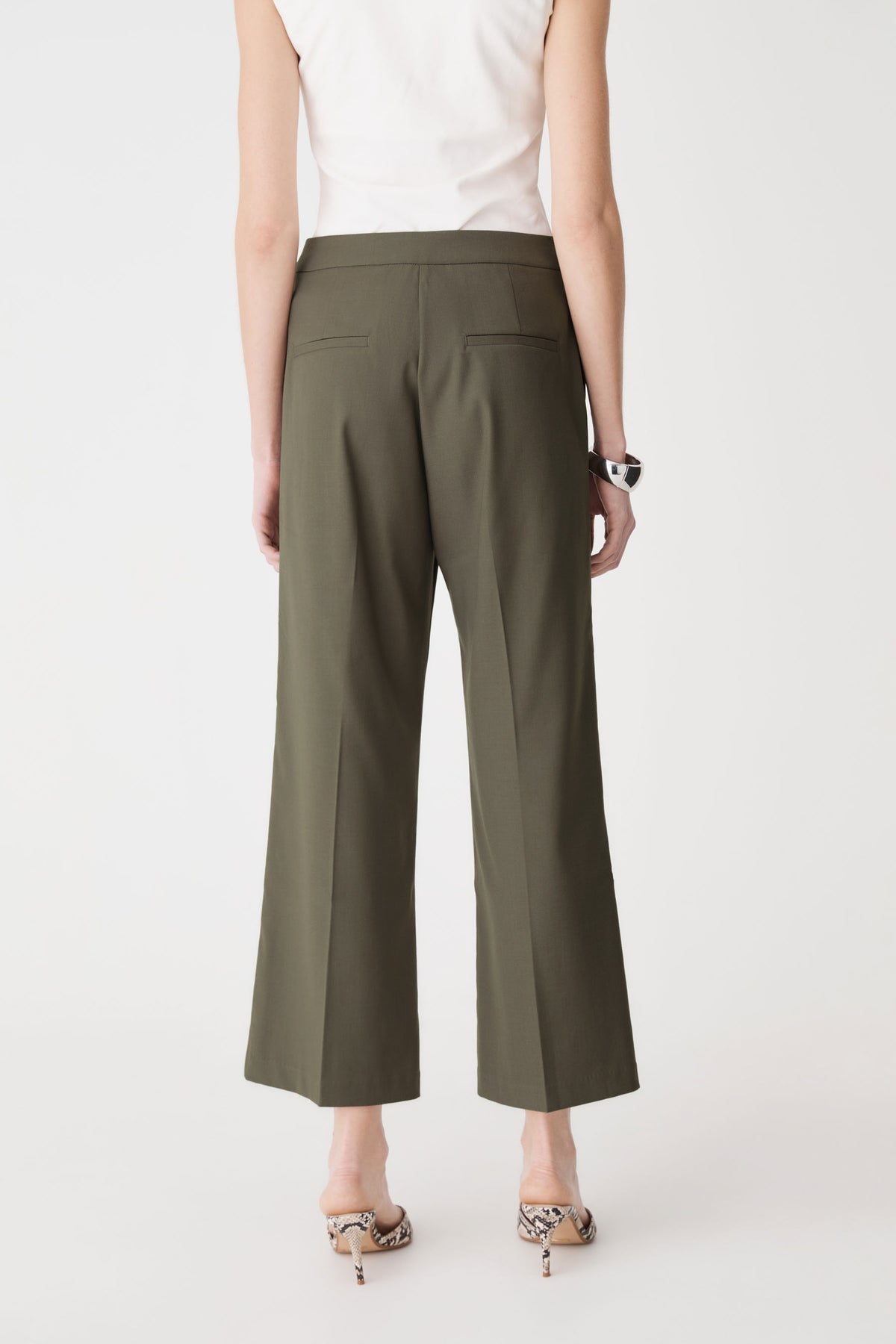 Back view of olive Milan Crop Flare Pants showing back welt pockets