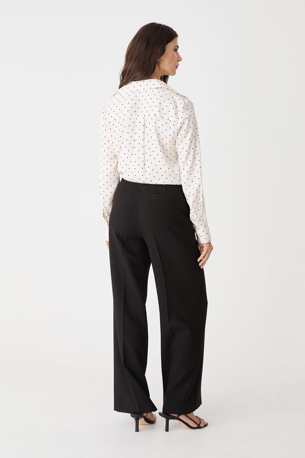 Back view of the black straight leg pants with back welt pockets