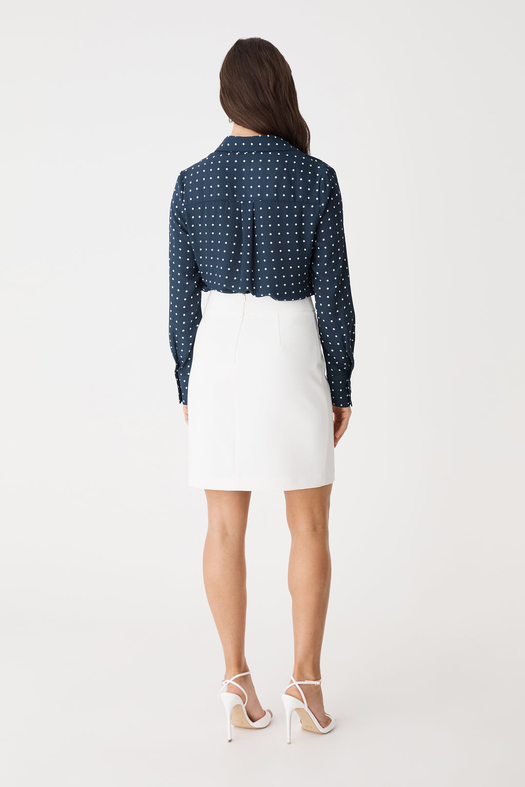 Back view showing the concealed centre-back zip of the ivory skirt