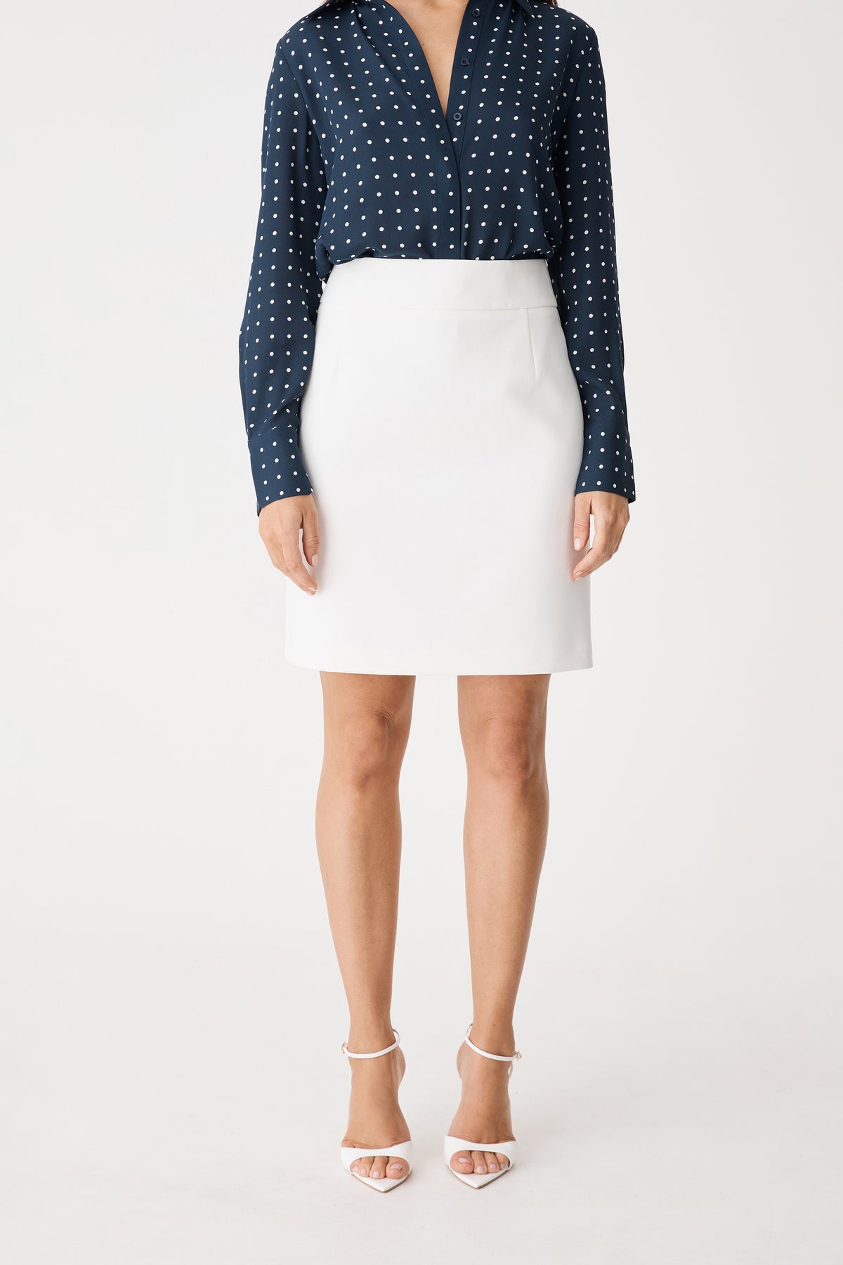 Lydia Short Straight Skirt in ivory, front view worn with a navy print shirt