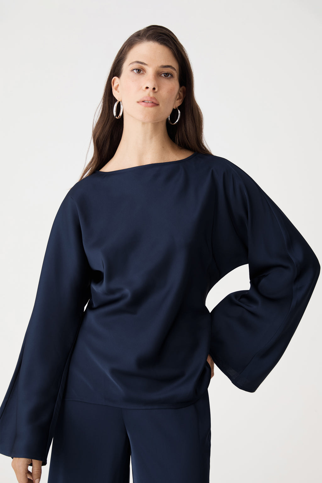 Close-up front view of navy Asma Satin Bias Top showing boat neckline and flared sleeves