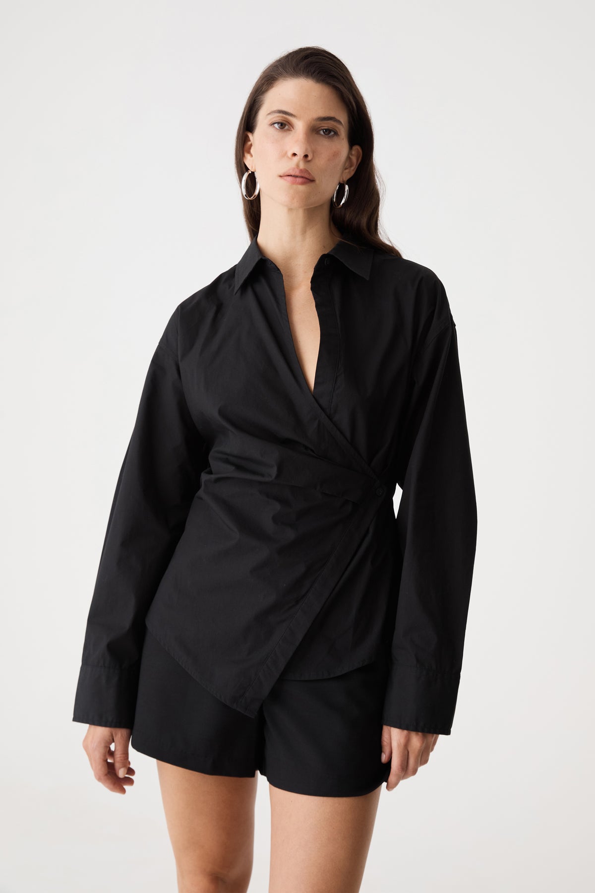Front close-up of the black Katrina Wrap Shirt showing pointed collar and wrap front