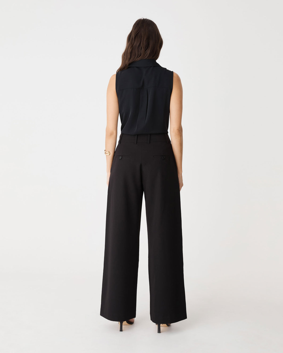 Back view of the black Brooklyn Sleeveless Shirt showing yoke and box pleat