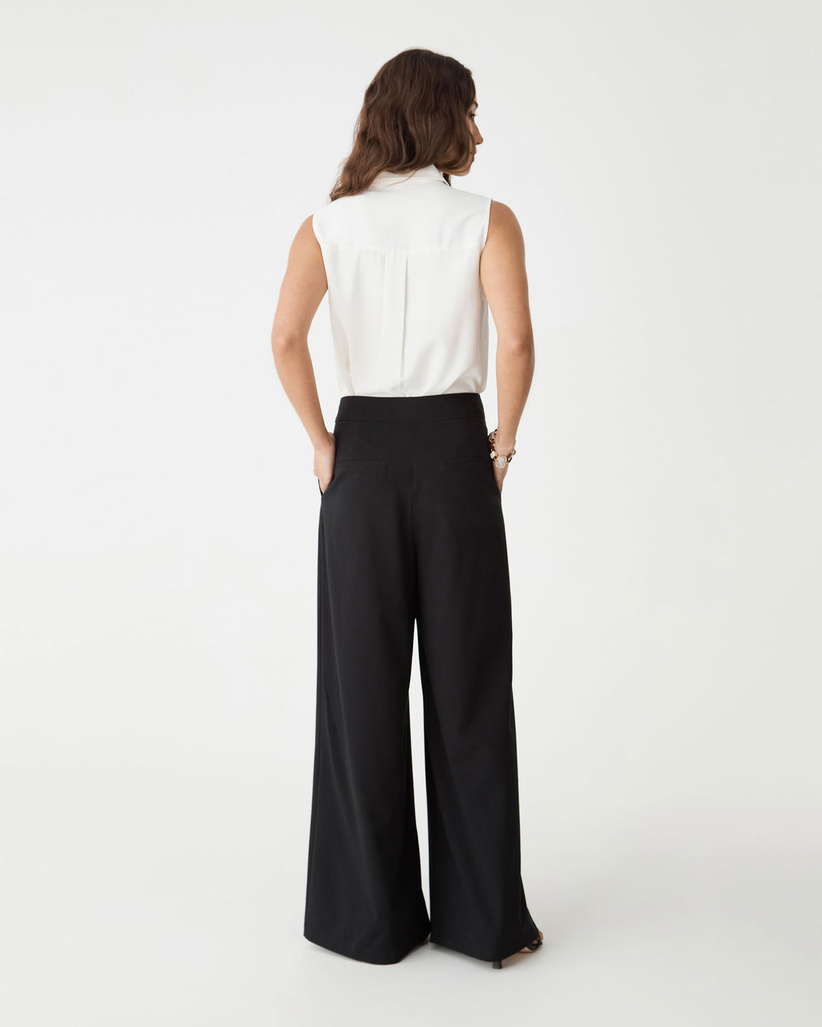 Back view of the ivory Brooklyn Sleeveless Shirt showing yoke and centre box pleat