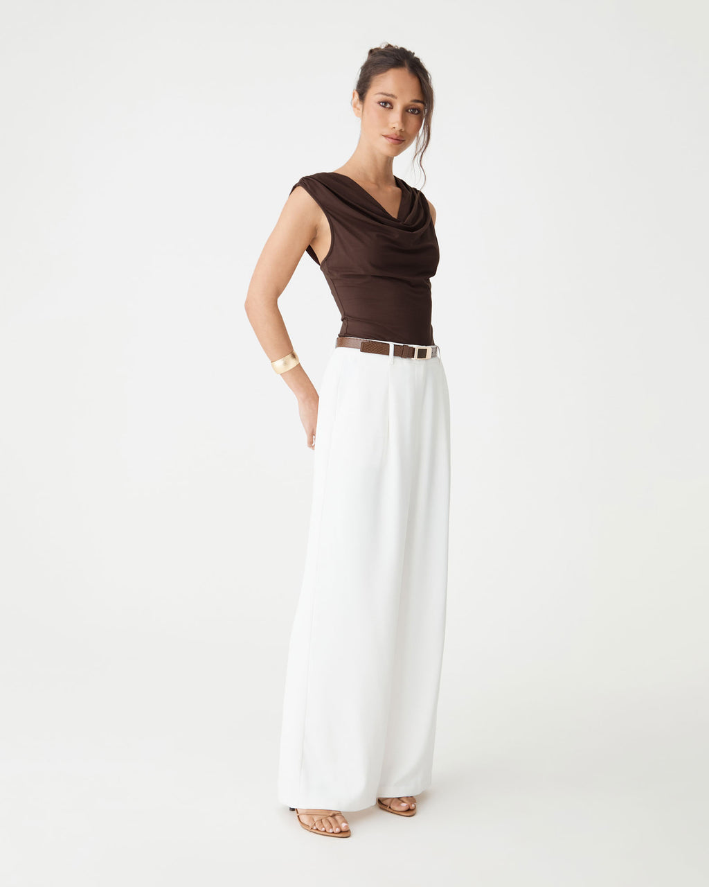 Side view of the Shayna Bamboo Cowl Top in Fudge with white trousers