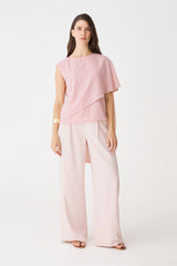 Cecilia Asymmetric Top in dusty pink, front view with cape overlay, worn with pale pink wide-leg trousers