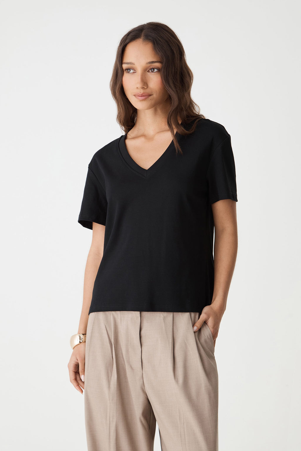 May V-Neck Cotton T-Shirt in black, front view worn with taupe wide-leg pants