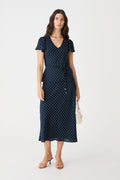 Danielle Frill Sleeve Top in Navy Spot, front view worn with matching polka dot midi skirt and tie belt
