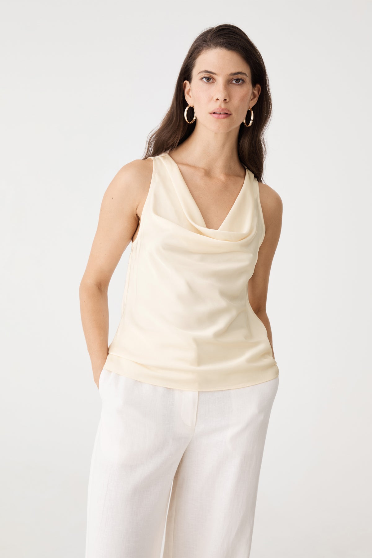 Aurelia Satin Cowl Neck Top in champagne, front view worn with white wide-leg trousers