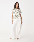 Natalie Floral Crepe Tee in cream with olive line-art floral print, front view with white wide-leg trousers