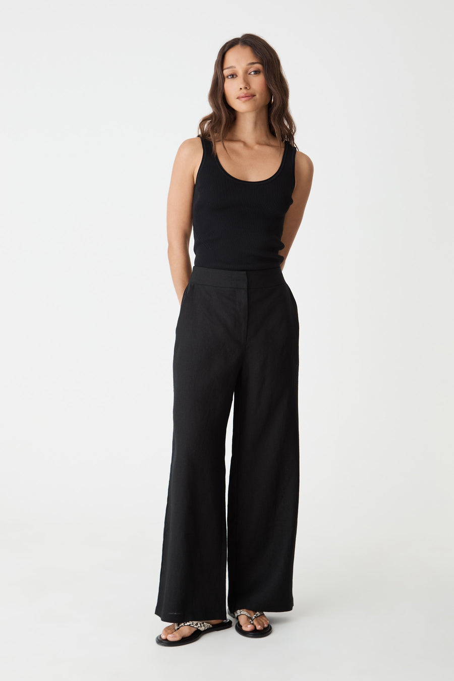 Ami Linen Elastic Back Pants in black, front view, worn with a black tank top