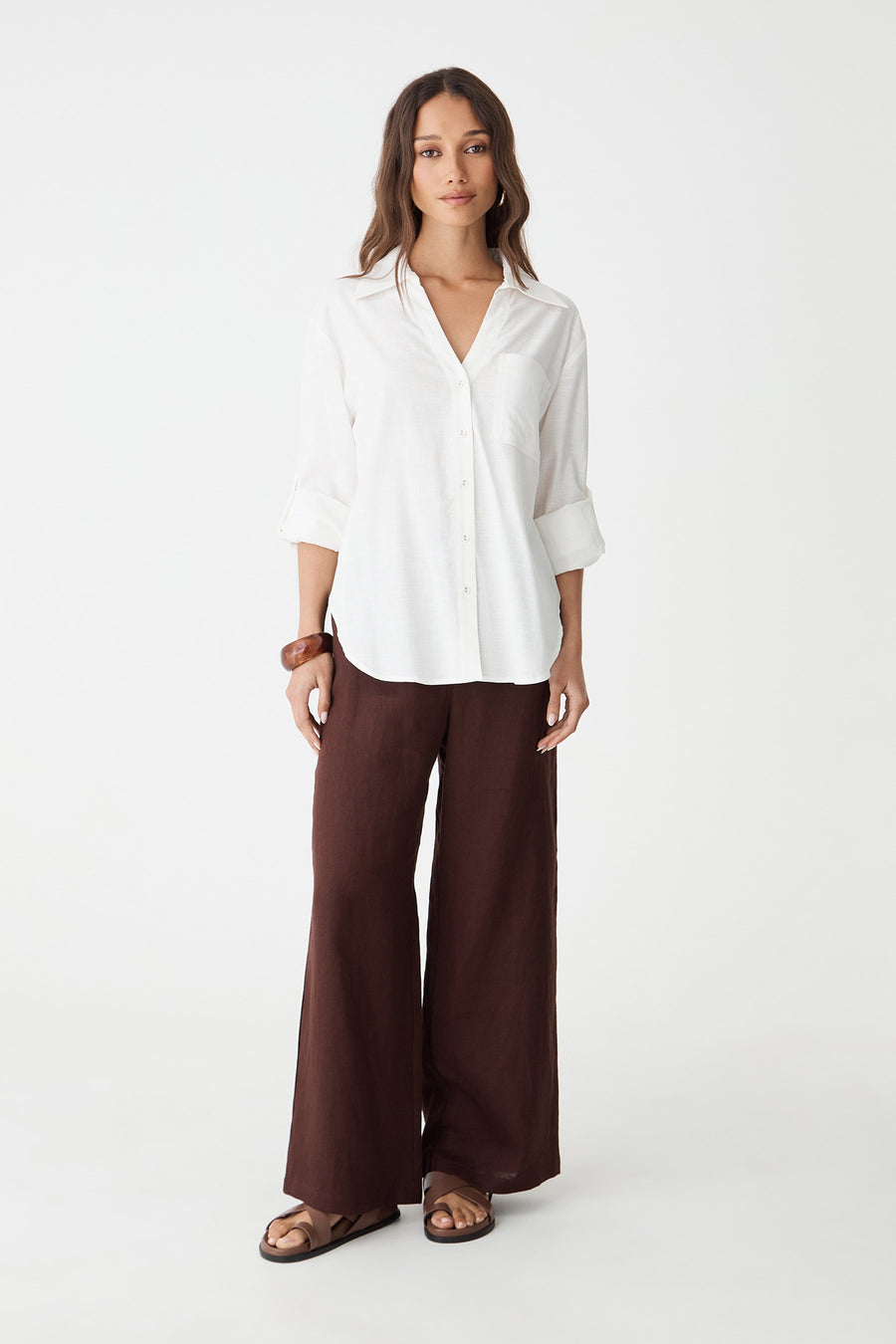 Ami Linen Elastic Back Pants in dark chocolate, front view, worn with a white linen shirt